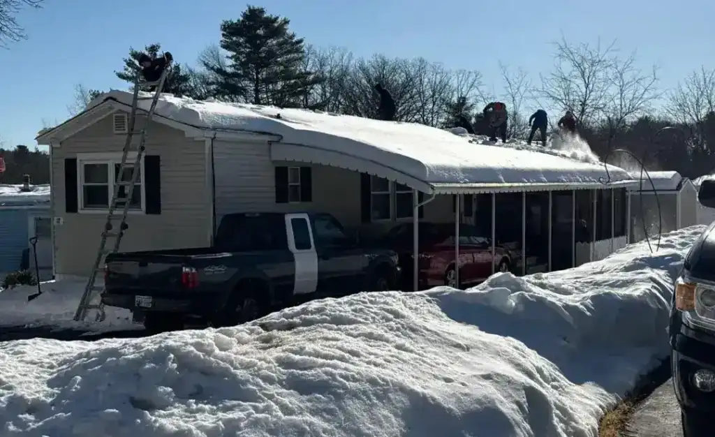Imgi 64 crew performing roof snow ice removal